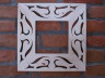 Decorative mirror frame with an ornament